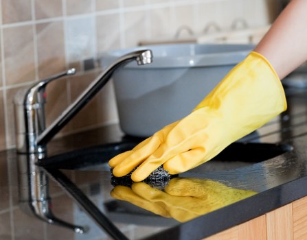 Window cleaner working on a residential property in Acton