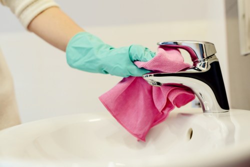 Cleaner using safe working practices during a cleaning task