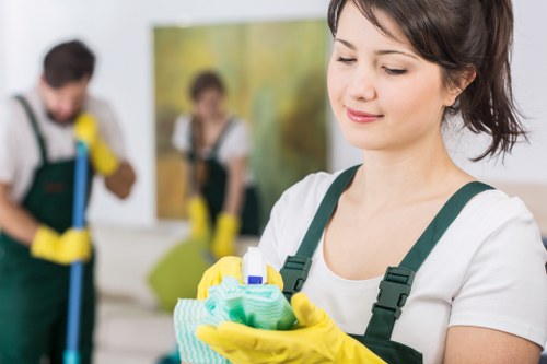 Professional cleaner completing final service notes before departure